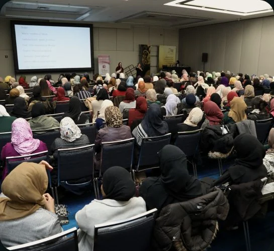 Attendees in a Being ME conference session